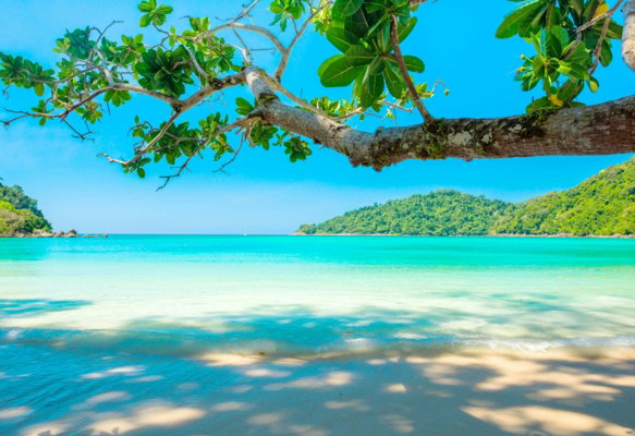 ocean-surrounded-by-island-under-blue-sky.jpg ocean surrounded by island under blue sky