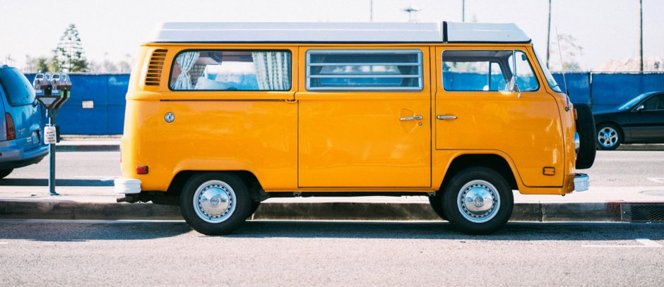 yellow minivan on parking lot